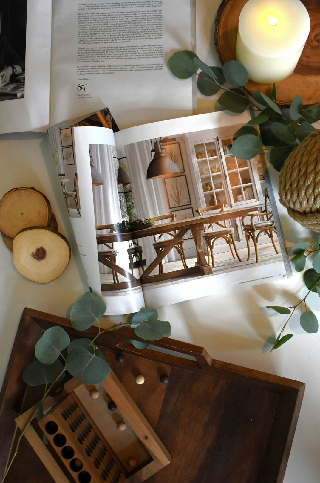 Open magazine layout with interior photography on a table