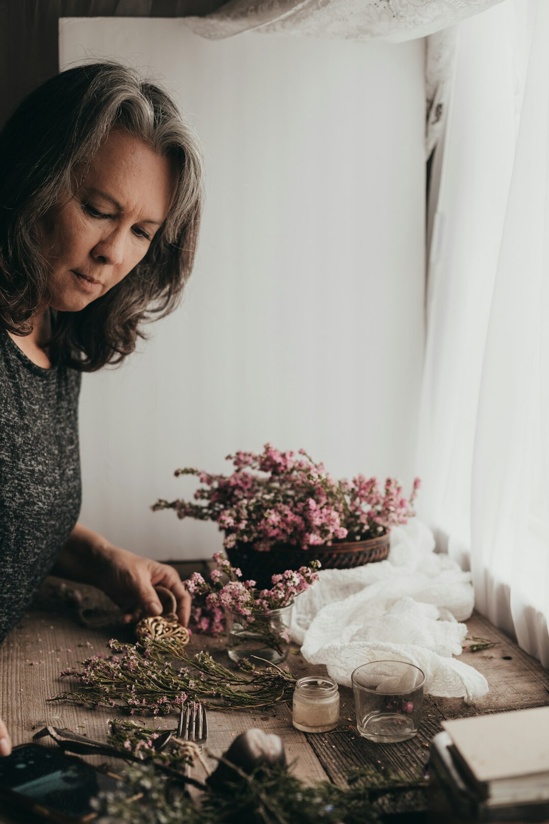 Stylist arranging decorative objects for a photo shoot